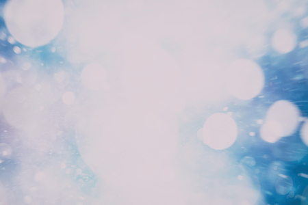 Festive Christmas background. Elegant abstract background with bokeh defocused lights and stars