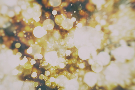 Festive Christmas background. Elegant abstract background with bokeh defocused lights and starsの写真素材
