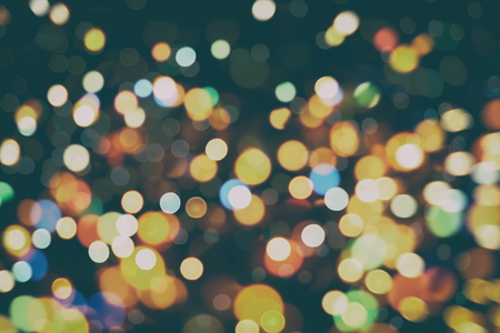 Abstract Festive background. Glitter vintage lights background with lights defocused. Christmas and New Year feast bokeh background with copyspace.の写真素材