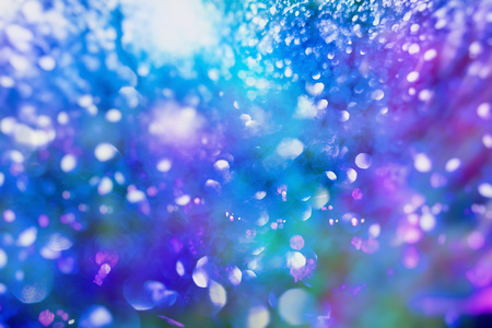 Abstract Festive background. Glitter vintage lights background with lights defocused.
