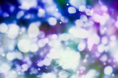 Abstract Festive background. Glitter vintage lights background with lights defocused.