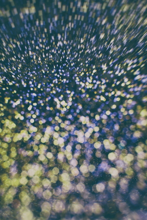 Abstract Festive background. Glitter vintage lights background with lights defocused.の写真素材