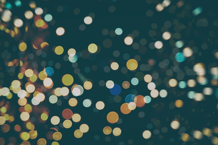 Abstract Festive background. Glitter vintage lights background with lights defocused.の写真素材