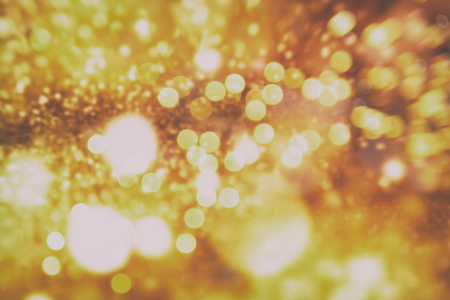 Abstract Festive background. Glitter vintage lights background with lights defocused.の写真素材