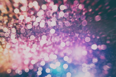 Abstract Festive background. Glitter vintage lights background with lights defocused.の写真素材