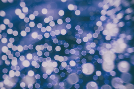 Abstract Festive background. Glitter vintage lights background with lights defocused.の写真素材