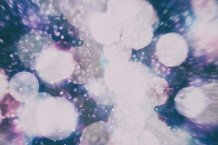 Abstract Festive background. Glitter vintage lights background with lights defocused.の写真素材
