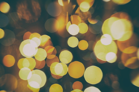 Abstract Festive background. Glitter vintage lights background with lights defocused.の写真素材