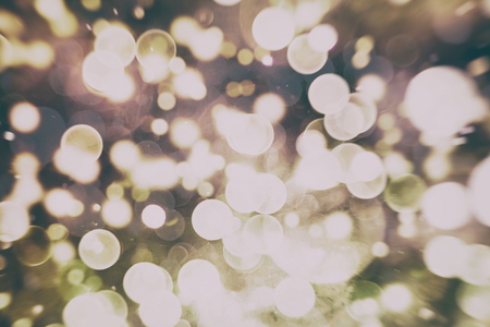 Abstract Festive background. Glitter vintage lights background with lights defocused.の写真素材