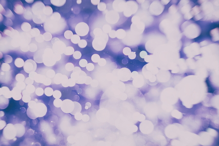 Abstract Festive background. Glitter vintage lights background with lights defocused.の写真素材