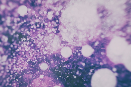 Abstract Festive background. Glitter vintage lights background with lights defocused.の写真素材