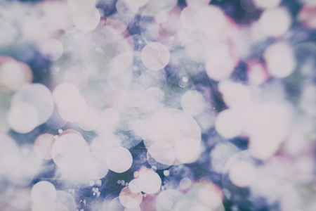 Abstract Festive background. Glitter vintage lights background with lights defocused.の写真素材