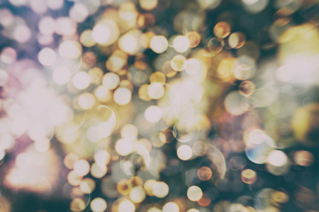 Abstract Festive background. Glitter vintage lights background with lights defocused.の写真素材