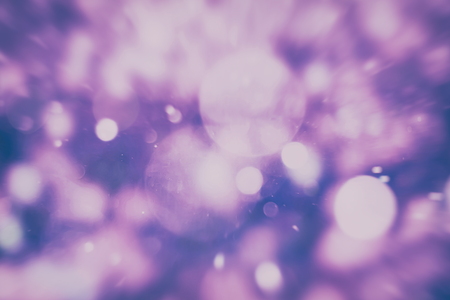 Abstract Festive background. Glitter vintage lights background with lights defocused. Christmas and New Year feast bokeh background with copyspace.の写真素材