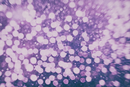 Abstract Festive background. Glitter vintage lights background with lights defocused. Christmas and New Year feast bokeh background with copyspace.の写真素材