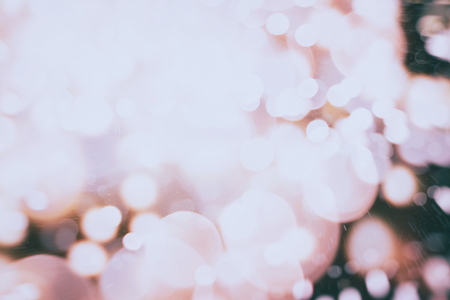 Abstract Festive background. Glitter vintage lights background with lights defocused. Christmas and New Year feast bokeh background with copyspace.の写真素材