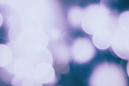 Abstract Festive background. Glitter vintage lights background with lights defocused. Christmas and...