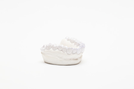 Close-up individual tooth tray Orthodontic dental theme. Invisible braces