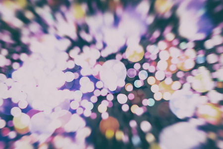 Abstract Festive background. Glitter vintage lights background with lights defocused. Christmas and...
