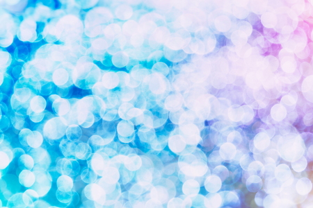 Abstract Festive background. Glitter vintage lights background with lights defocused. Christmas and New Year feast bokeh background with copyspace.の写真素材