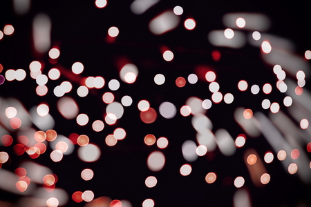 Glittering shine bulbs lights background blur of Christmas wallpaper decorations concept.の写真素材