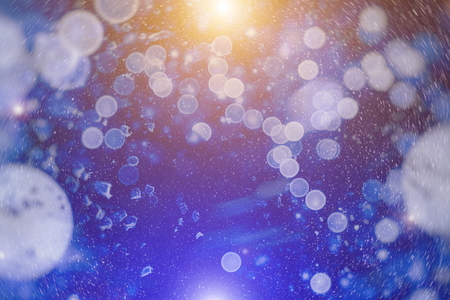 Bright abstract bokeh background blur on a dark background