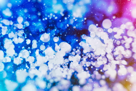 glittering shine bulbs lights background: blur of Christmas wallpaper decorations concept.holiday festival backdrop: sparkle circle lit celebrations display.の写真素材