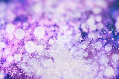 abstract blurred of blue and silver glittering shine bulbs background: blur of Christmas wallpaper decorations concept.xmas holiday festival backdrop: sparkle circle lit celebrations display.の写真素材