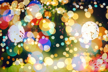 Festive Christmas background. Elegant abstract background with bokeh defocused lights and starsの写真素材