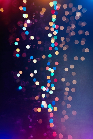 glittering shine bulbs lights background:blur of Christmas wallpaper decorations concept.holiday festival backdrop:sparkle circle lit celebrations display.の写真素材