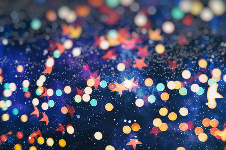 glittering shine bulbs lights background:blur of Christmas wallpaper decorations concept.holiday festival backdrop:sparkle circle lit celebrations display.の写真素材