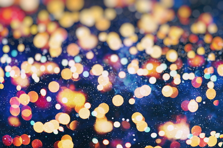 glittering shine bulbs lights background:blur of Christmas wallpaper decorations concept.holiday festival backdrop:sparkle circle lit celebrations display.の写真素材
