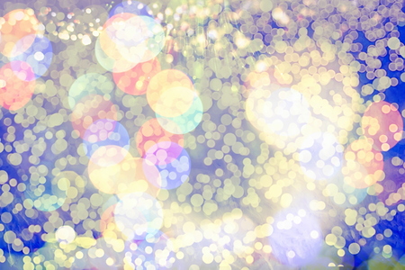 glittering shine bulbs lights background:blur of Christmas wallpaper decorations concept.holiday...