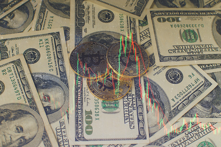 Bitcoin and one cent coin on US dollar bills, macro shotの写真素材
