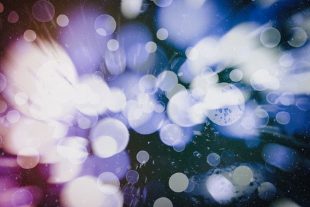 glittering shine bulbs lights background:blur of Christmas wallpaper decorations concept.holiday festival backdrop:sparkle circle lit celebrations display.の写真素材