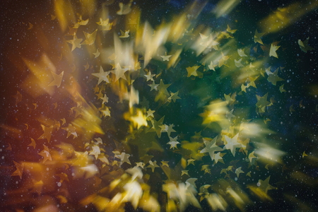 Abstract light celebration background with defocused golden lights for Christmas, New Year, Holiday,...