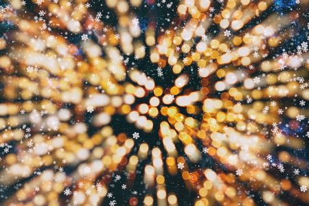 Christmas light background. Holiday glowing backdrop. Defocused Background With Blinking Stars. Blurred Bokeh.の写真素材