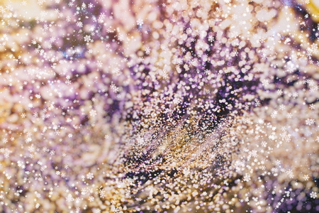 Christmas light background. Holiday glowing backdrop. Defocused Background With Blinking Stars. Blurred Bokeh.の写真素材