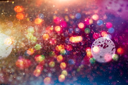 Abstract Festive background. Glitter vintage lights background with lights defocused. Christmas and New Year feast bokeh background with copyspace.の写真素材
