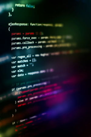 Website HTML Code on the Laptop Display Closeup Photo. Desktop PC monitor photo.