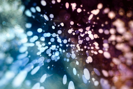 Abstract glitter lights and stars. Festive blue and white color sparkling vintage backgroundの写真素材