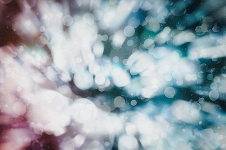 Blurred bokeh light background, Christmas and New Year holidays backgroundの写真素材