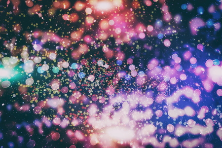 Bright abstract circular bokeh background blur on a dark backgroundの写真素材