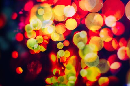 Vintage magic background with color festive background with natural bokeh and bright golden lights.の写真素材
