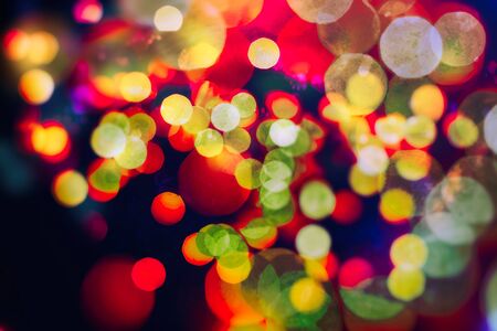 Vintage magic background with color festive background with natural bokeh and bright golden lights.の写真素材