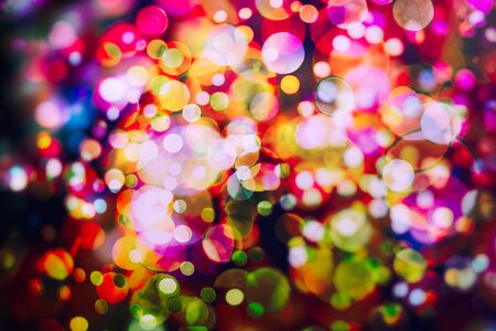 Vintage magic background with color festive background with natural bokeh and bright golden lights.の写真素材