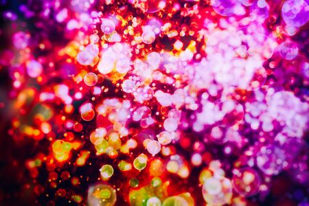 Colored abstract blurred light glitter background layout design can be use for background concept or festival background. Bokeh with multi colorsの写真素材