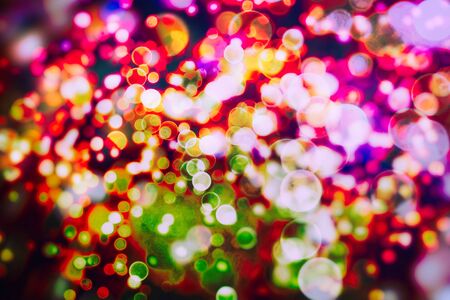 Colored abstract blurred light glitter background layout design can be use for background concept or festival background. Bokeh with multi colorsの写真素材