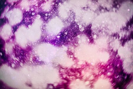 Christmas bokeh glowing Background. Glowing holiday abstract defocused colorful backdrop. Bright vivid blurred colourful new year holiday bokehの写真素材
