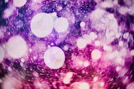 Sparkle background de-focused bokeh abstract Christmas copy space shimmering blue spotlights defocused golden lights new years disco partyの写真素材